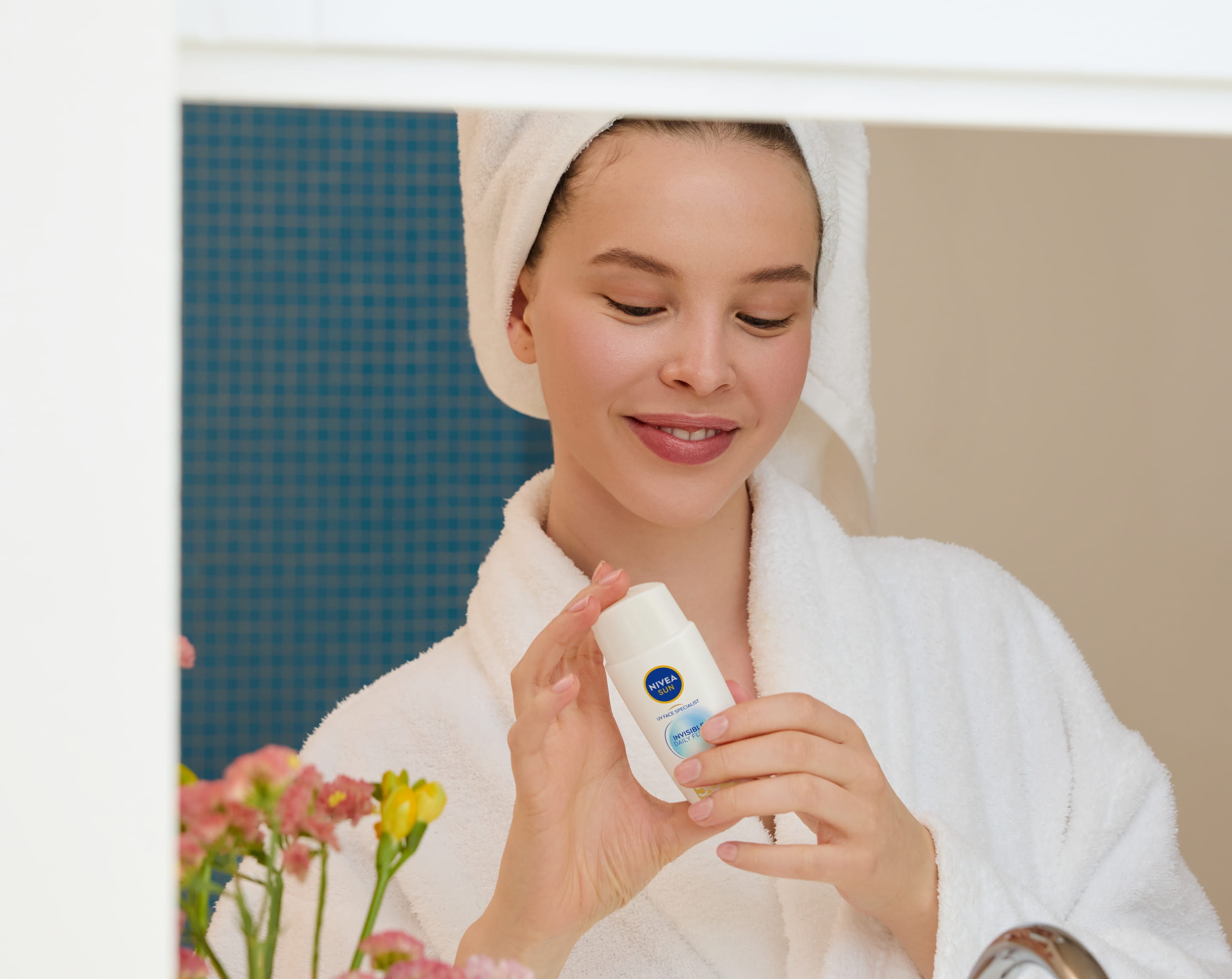 woman holding sunscreen
